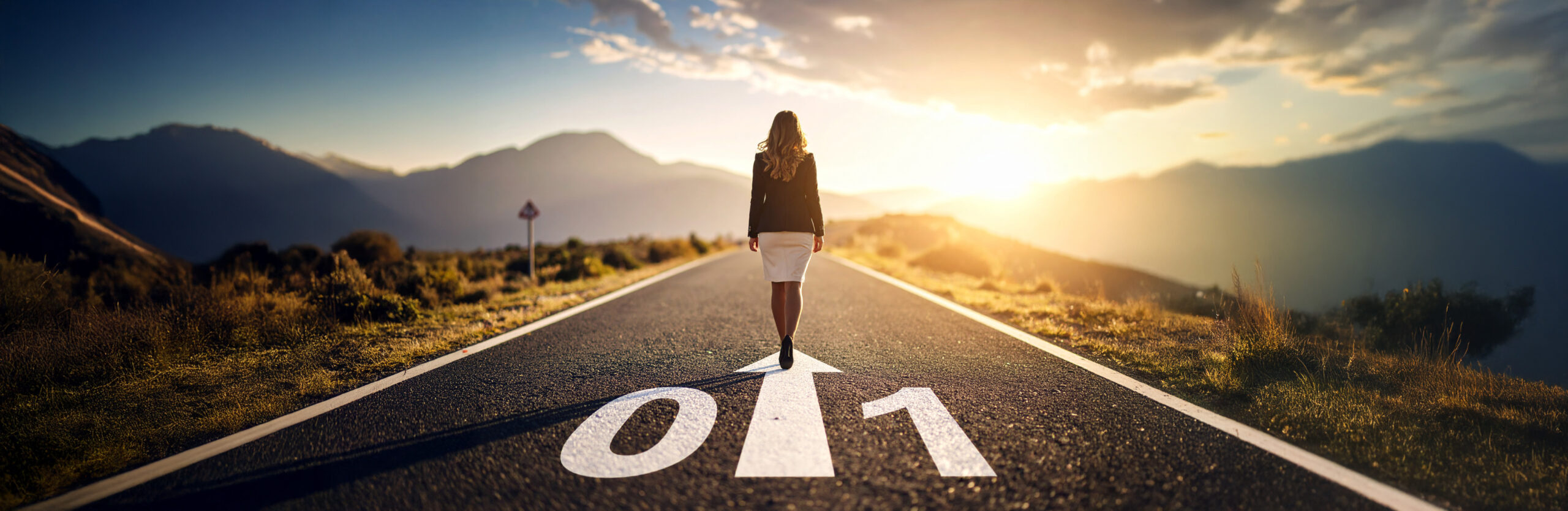 Woman walking on a road marked "0 1" toward the horizon, symbolizing the journey from concept to execution with Zero to 1 Experts.